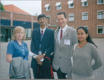 Photo of four attendees of the conference
