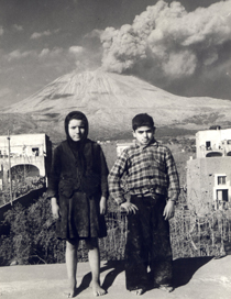 Photo of Mount Vesuvius and children from covered homes