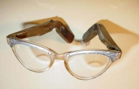 Photograph of eye glasses with hearing aid